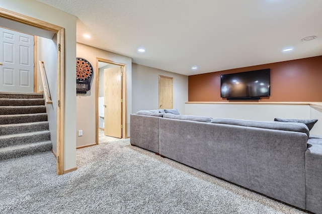 carpeted living room with recessed lighting, stairs, and baseboards