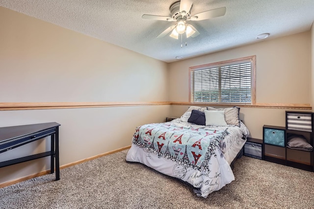bedroom featuring baseboards, a ceiling fan, a textured ceiling, and carpet flooring