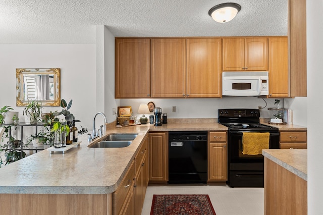 kitchen featuring black appliances, a sink, a peninsula, a textured ceiling, and light countertops