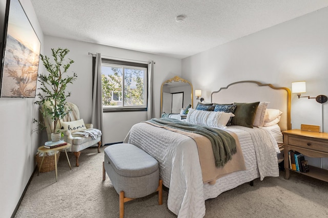 bedroom with carpet flooring and a textured ceiling