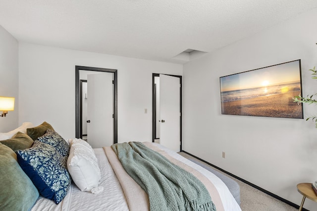 carpeted bedroom with baseboards