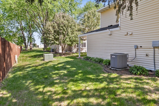 view of yard with central air condition unit