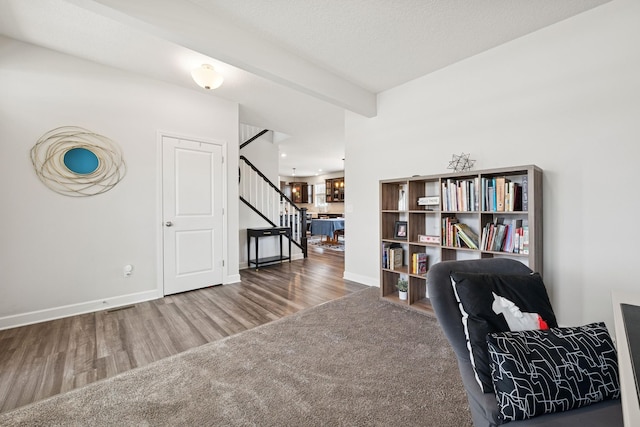 12985 Legacy Creek Pkwy NE, Blaine, MN 55449 - living area featuring stairway, wood finished floors, and baseboards