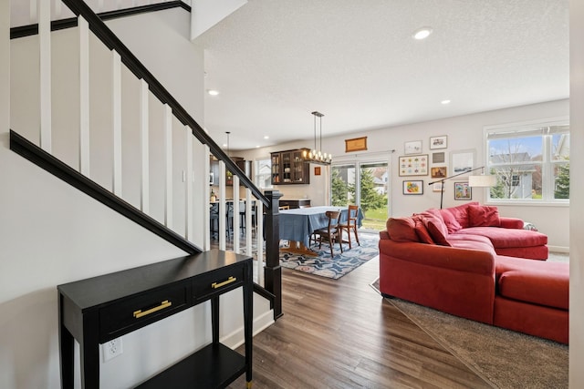 12985 Legacy Creek Pkwy NE, Blaine, MN 55449 - living area featuring stairway, a chandelier, wood finished floors, recessed lighting, and a textured ceiling