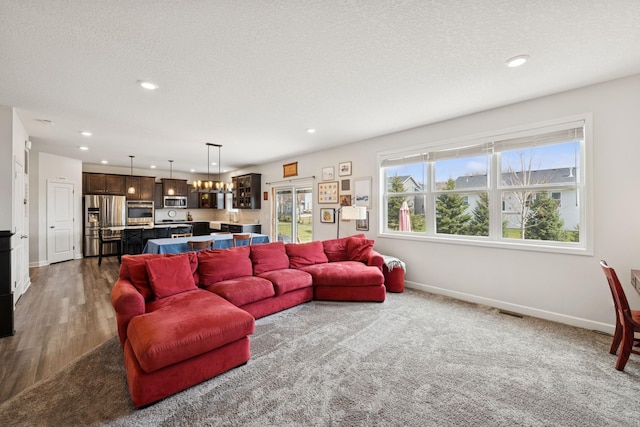 12985 Legacy Creek Pkwy NE, Blaine, MN 55449 - living room featuring baseboards, recessed lighting, dark wood finished floors, and a textured ceiling