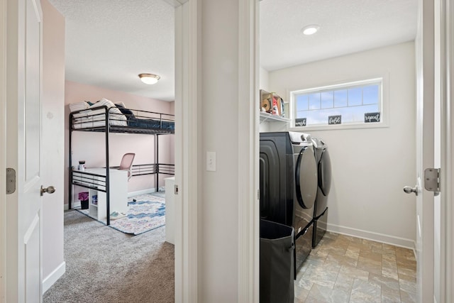 12985 Legacy Creek Pkwy NE, Blaine, MN 55449 - washroom with separate washer and dryer, baseboards, carpet, and a textured ceiling