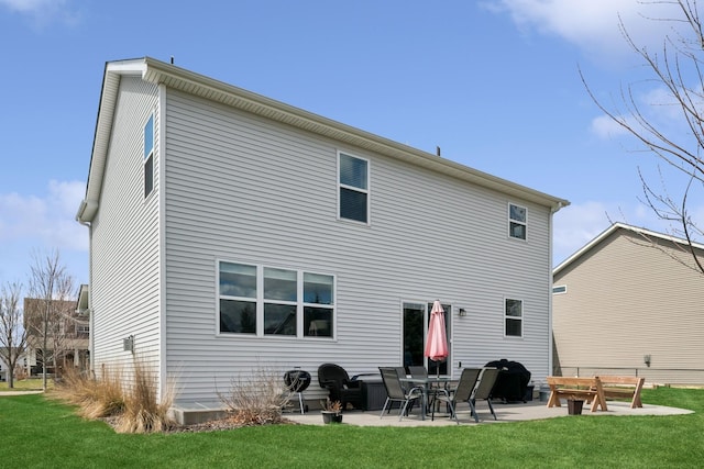 12985 Legacy Creek Pkwy NE, Blaine, MN 55449 - back of house featuring a patio and a yard