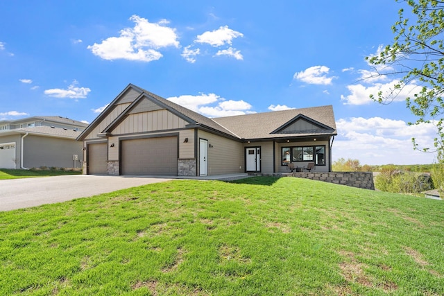 1302 Windrush Rd, Buffalo, MN 55313 - view of front facade featuring concrete driveway, an attached garage, a front lawn, board and batten siding, and stone siding