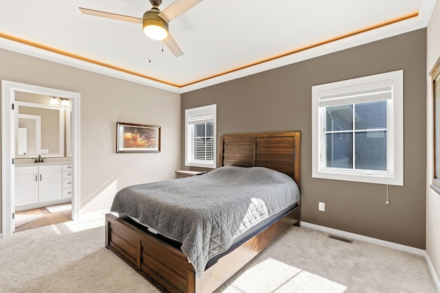 1302 Windrush Rd, Buffalo, MN 55313 - bedroom featuring light carpet, a sink, ensuite bath, and baseboards