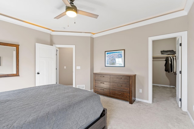 1302 Windrush Rd, Buffalo, MN 55313 - bedroom featuring light colored carpet, a walk in closet, crown molding, baseboards, and a ceiling fan