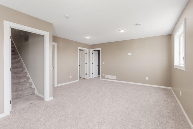 1302 Windrush Rd, Buffalo, MN 55313 - spare room with light carpet, baseboards, and stairway