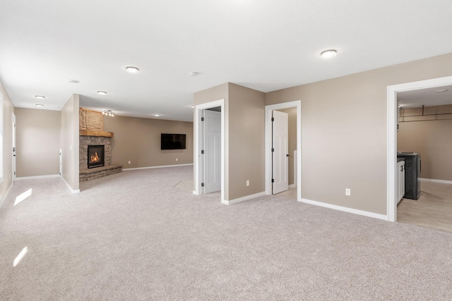 1302 Windrush Rd, Buffalo, MN 55313 - unfurnished living room featuring baseboards, light carpet, and a fireplace