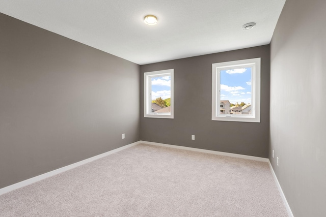 1302 Windrush Rd, Buffalo, MN 55313 - spare room featuring light carpet and baseboards