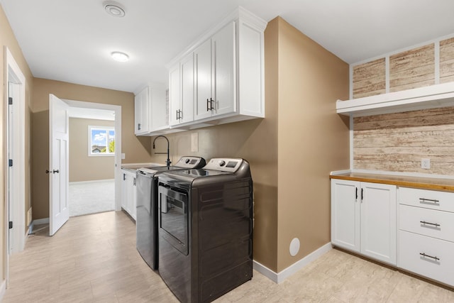 1302 Windrush Rd, Buffalo, MN 55313 - laundry room with washer and dryer, baseboards, and cabinet space