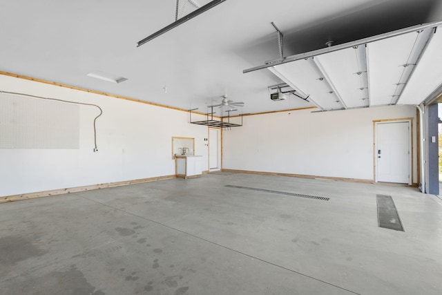 1302 Windrush Rd, Buffalo, MN 55313 - garage with a garage door opener and baseboards