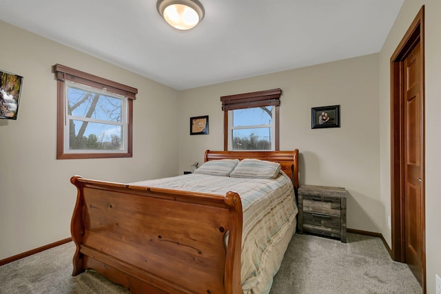 bedroom with baseboards and carpet flooring
