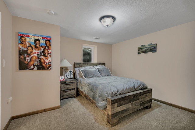 bedroom with carpet floors and baseboards