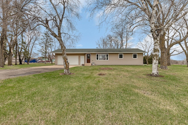 single story home with an attached garage, driveway, and a front yard