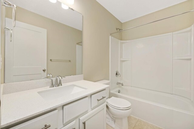 full bathroom featuring vanity, tile patterned flooring, toilet, and shower / tub combination