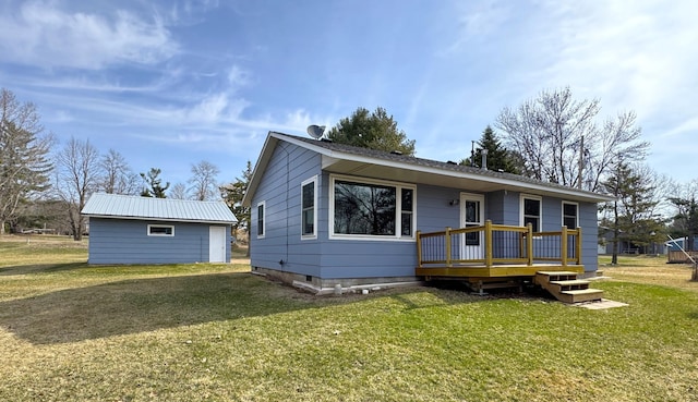 view of front of house with a wooden deck and a front yard