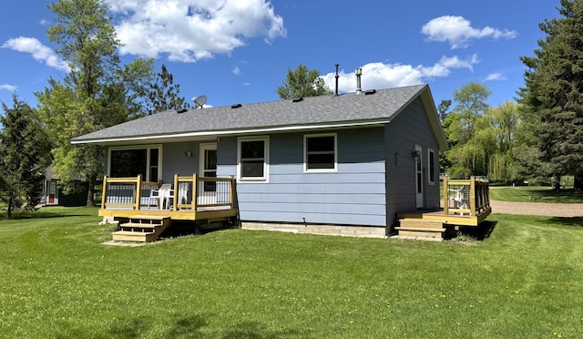 36777 311th Ln, Aitkin, MN 56431 - rear view of house featuring a deck, a yard, and roof with shingles