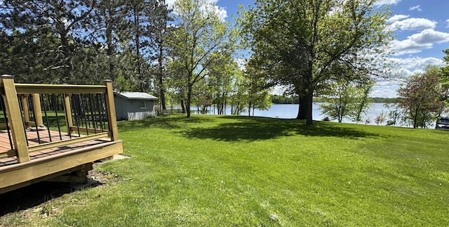 36777 311th Ln, Aitkin, MN 56431 - view of grassy yard featuring a deck with water view