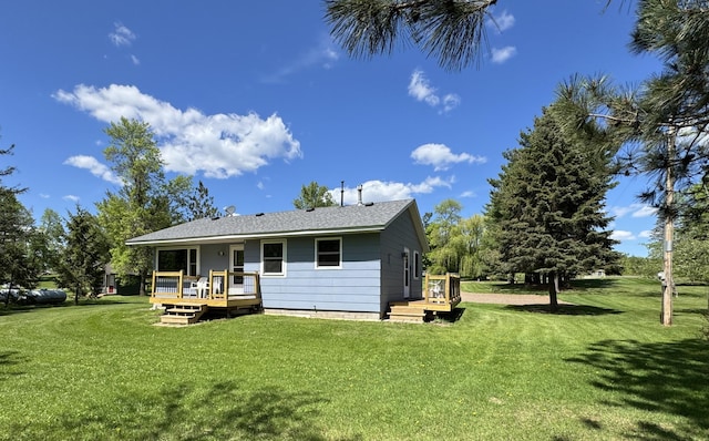 36777 311th Ln, Aitkin, MN 56431 - rear view of property featuring a lawn and a wooden deck
