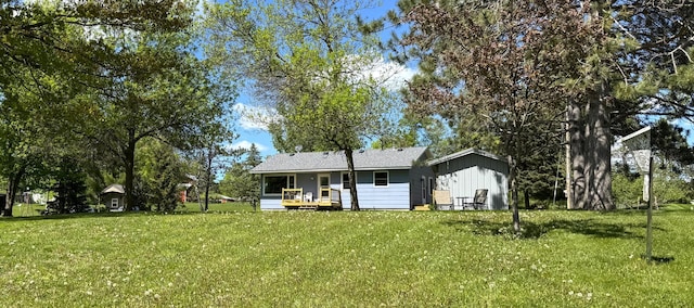 36777 311th Ln, Aitkin, MN 56431 - rear view of house with a lawn and a deck