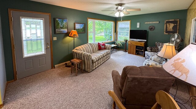 36777 311th Ln, Aitkin, MN 56431 - living room featuring carpet, a ceiling fan, and baseboards