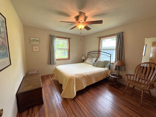 36777 311th Ln, Aitkin, MN 56431 - bedroom featuring wood finished floors, a textured ceiling, and ceiling fan