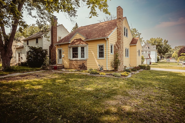 800 5th Ave SW, Austin, MN 55912 - view of front of house with a front yard and a chimney