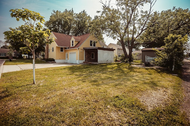 800 5th Ave SW, Austin, MN 55912 - view of front of property with concrete driveway, a front yard, and a garage