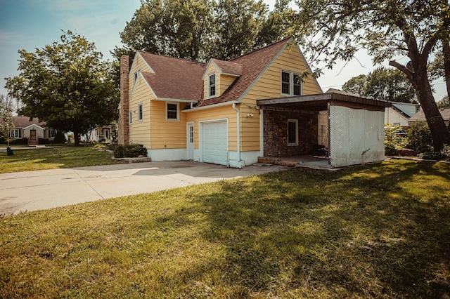 800 5th Ave SW, Austin, MN 55912 - view of front facade featuring concrete driveway, a front yard, a chimney, a shingled roof, and stone siding