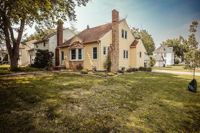 800 5th Ave SW, Austin, MN 55912 - view of side of home featuring a chimney and a lawn