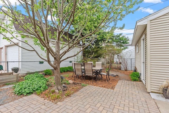 view of patio with fence and outdoor dining area