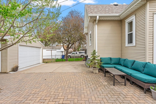 view of patio / terrace with fence, an outdoor living space, and decorative driveway