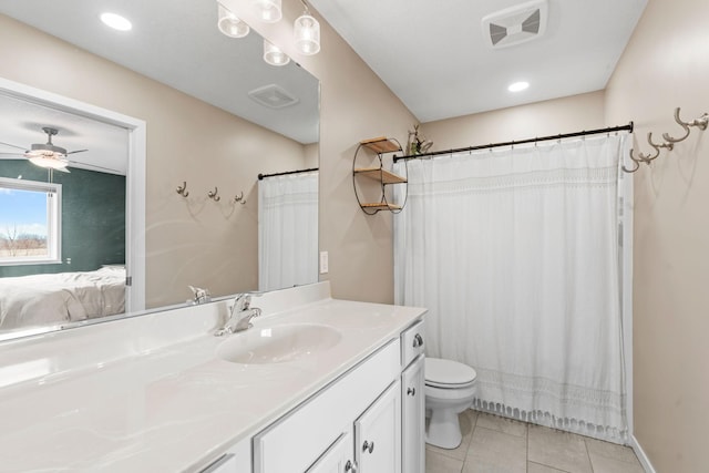 907 7th Ave, Wanamingo, MN 55983 - ensuite bathroom with vanity, toilet, tile patterned flooring, a ceiling fan, and recessed lighting