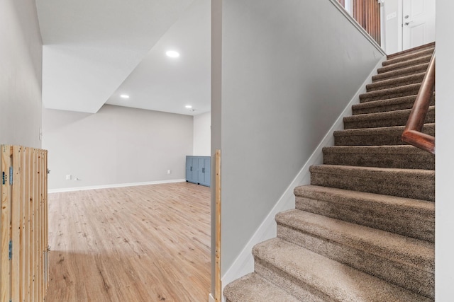 907 7th Ave, Wanamingo, MN 55983 - staircase with wood finished floors, baseboards, and recessed lighting