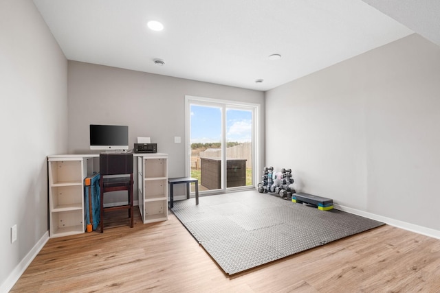 907 7th Ave, Wanamingo, MN 55983 - home office featuring wood finished floors, baseboards, and recessed lighting