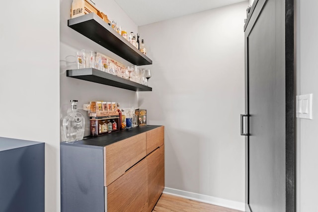 907 7th Ave, Wanamingo, MN 55983 - indoor dry bar featuring light wood-style flooring and baseboards