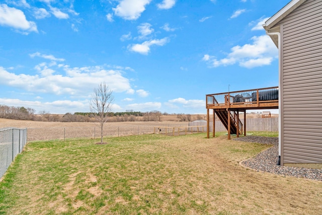 907 7th Ave, Wanamingo, MN 55983 - view of yard featuring a wooden deck, stairs, and a rural view
