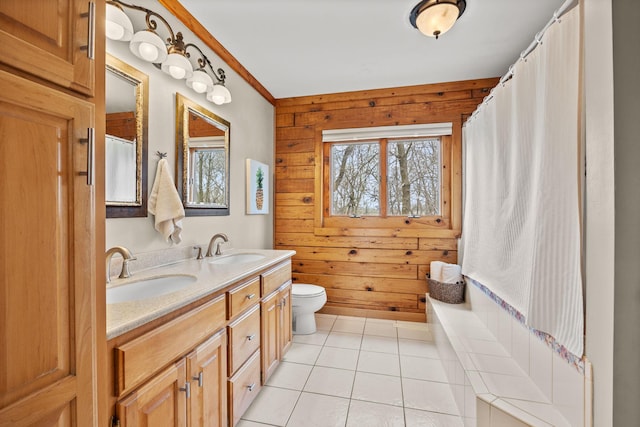 631 Pheasant Run, Winsted, MN 55395 - bathroom with plenty of natural light, wood walls, tile patterned floors, toilet, and double vanity