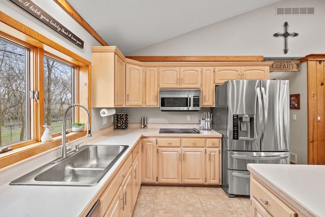 631 Pheasant Run, Winsted, MN 55395 - kitchen featuring appliances with stainless steel finishes, a sink, light brown cabinets, vaulted ceiling, and light countertops