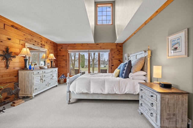 631 Pheasant Run, Winsted, MN 55395 - bedroom with light colored carpet, wood walls, access to outside, and a towering ceiling