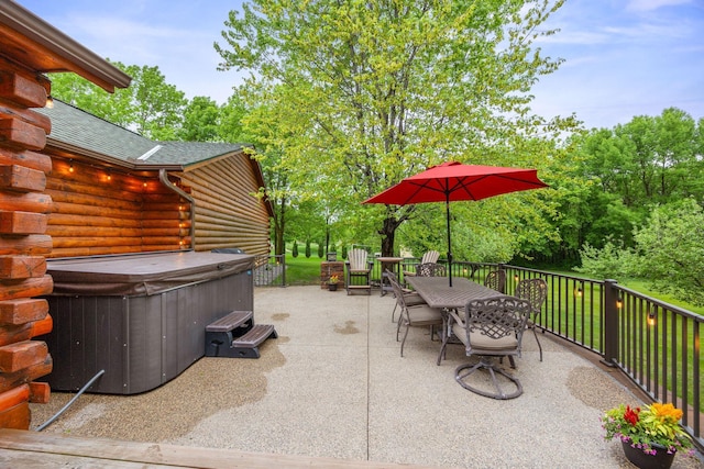 631 Pheasant Run, Winsted, MN 55395 - view of patio / terrace with a hot tub, outdoor dining area, and view of scattered trees