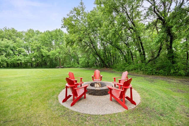 631 Pheasant Run, Winsted, MN 55395 - view of grassy yard with an outdoor fire pit