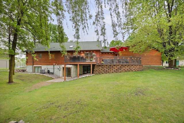 631 Pheasant Run, Winsted, MN 55395 - rear view of house featuring log siding, a lawn, central AC unit, and a wooden deck