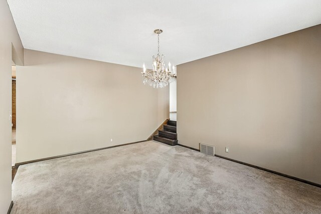 5411 Southwood Dr, Bloomington, MN 55437 - carpeted spare room with visible vents, baseboards, a notable chandelier, and stairway