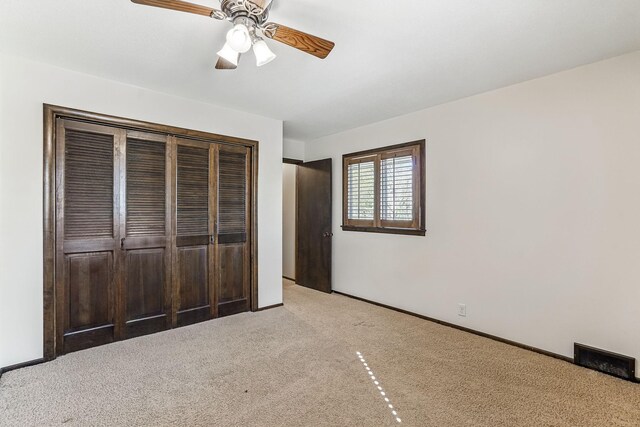 5411 Southwood Dr, Bloomington, MN 55437 - unfurnished bedroom with carpet flooring, ceiling fan, baseboards, visible vents, and a closet
