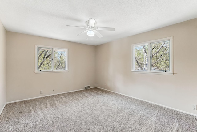 5411 Southwood Dr, Bloomington, MN 55437 - carpeted spare room with visible vents, a textured ceiling, baseboards, and ceiling fan